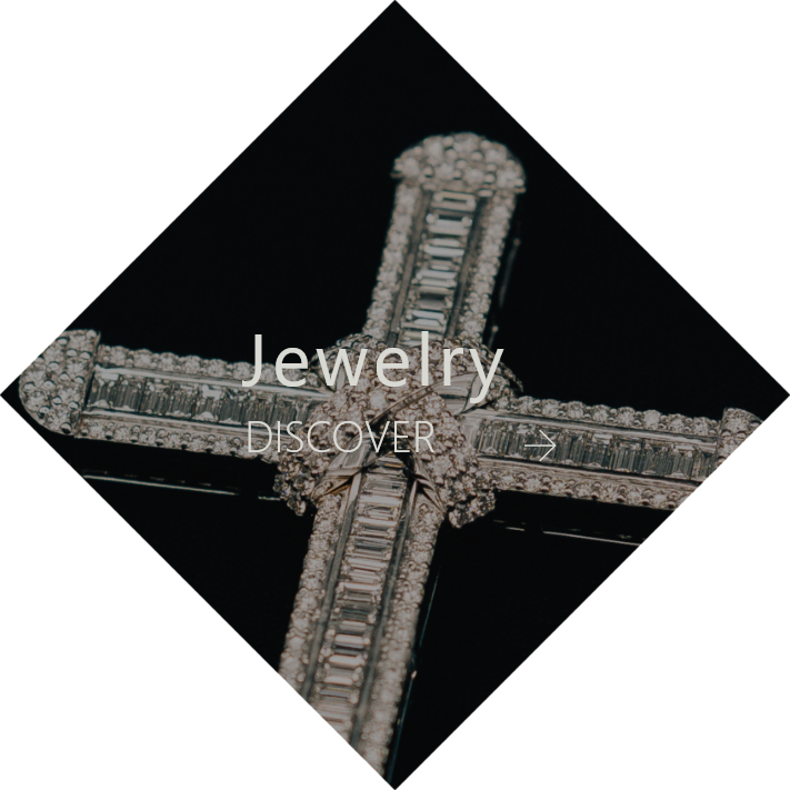 Jewelry featuring a cross adorned with sparkling diamonds
